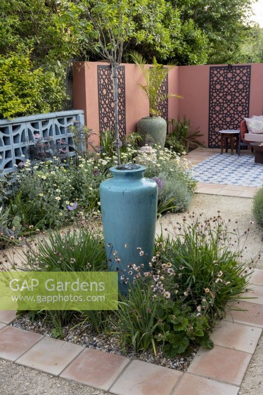 Mediterranean style garden and patio in suburban garden