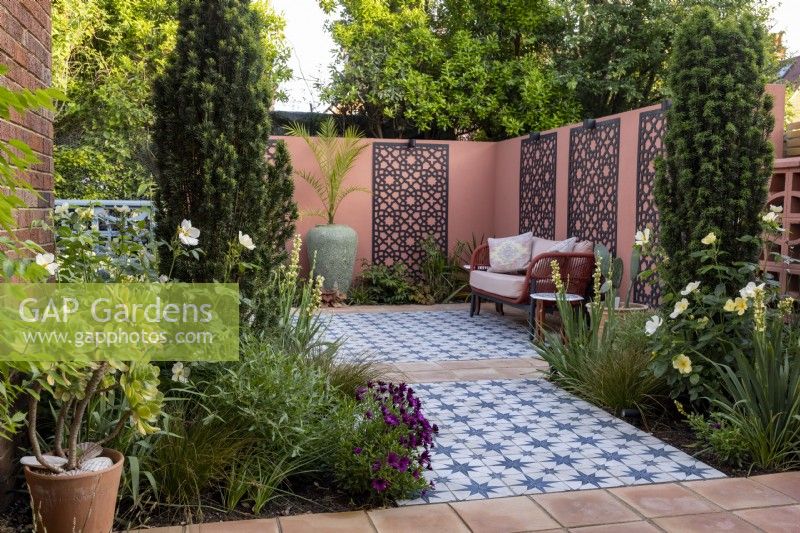 Moroccan style patio garden with decorative screens on wall