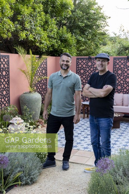 Designers Douglas Vieira and Nick Gough standing in garden they have designed