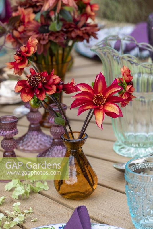 Late summer or autumn flower arrangements on outdoor dining table.  RHS Chelsea Flower Show 2021, Gaze Burvill Stand