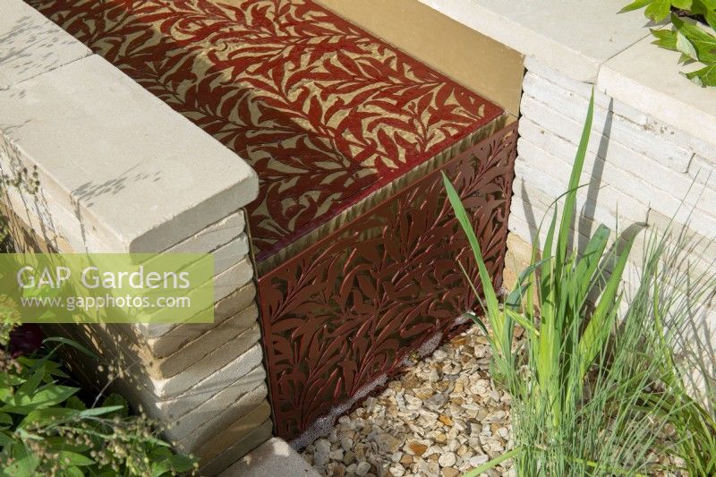 Water rill with laser cut insert in willow pattern - Morris  and  Co, RHS Chelsea Flower Show 2022 - Gold Medal