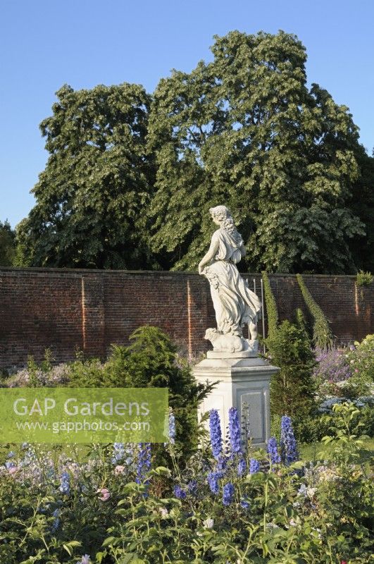 Profile of Flora statue - Goddess of Spring - in the Rose Garden at Hampton Court Palace - East Molesey, Surrey, UK