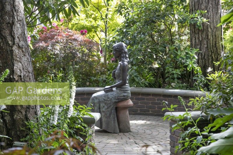 'The Secret Sits' - a bronze figure at Hamilton House garden in May 