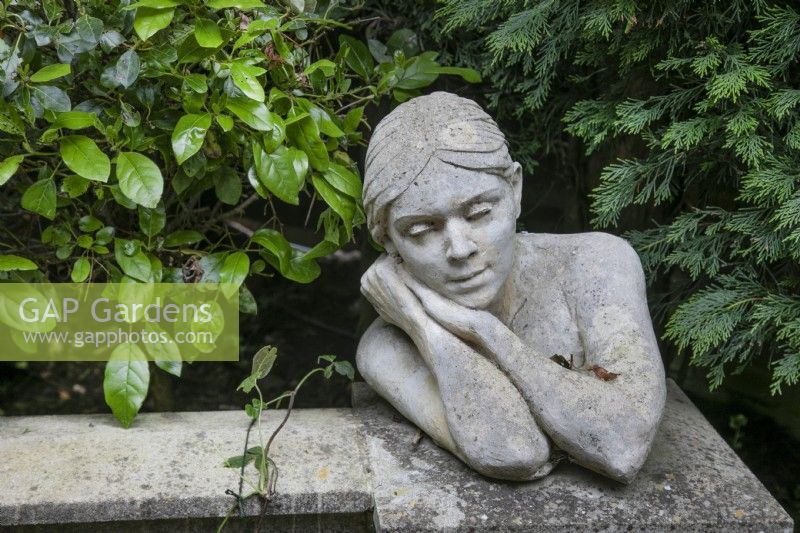 Seja a limestone female bust at Hamilton House garden in May 
