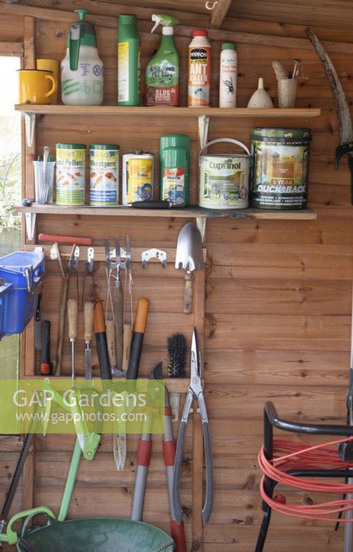 Interior of a well organised garden shed with various tools. Spring