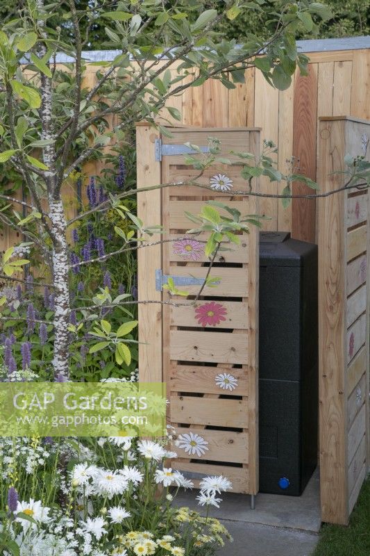 Decorative bin store in #knollingwithdaisies garden at RHS Hampton Court Palace Garden Festival 2022