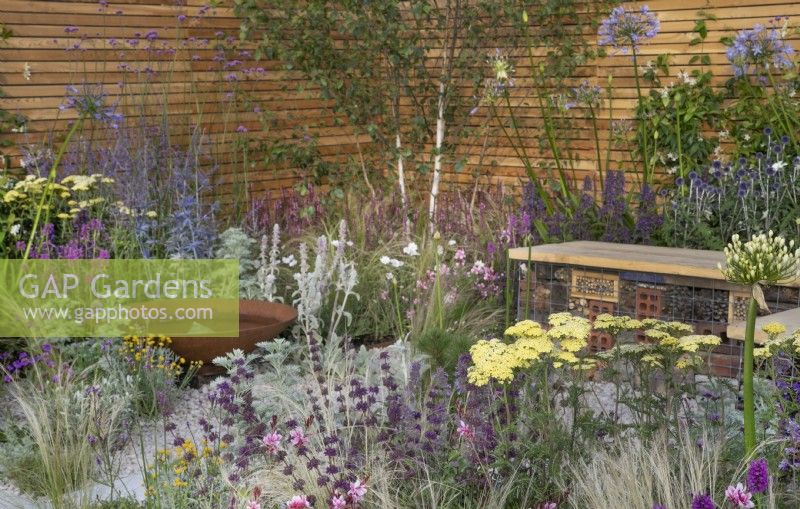 Pink and purple themed perennial planting in Turfed Out at RHS Hampton Court Palace Garden Festival 2022