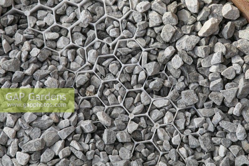 Hexagonal ground grid tile with gravel