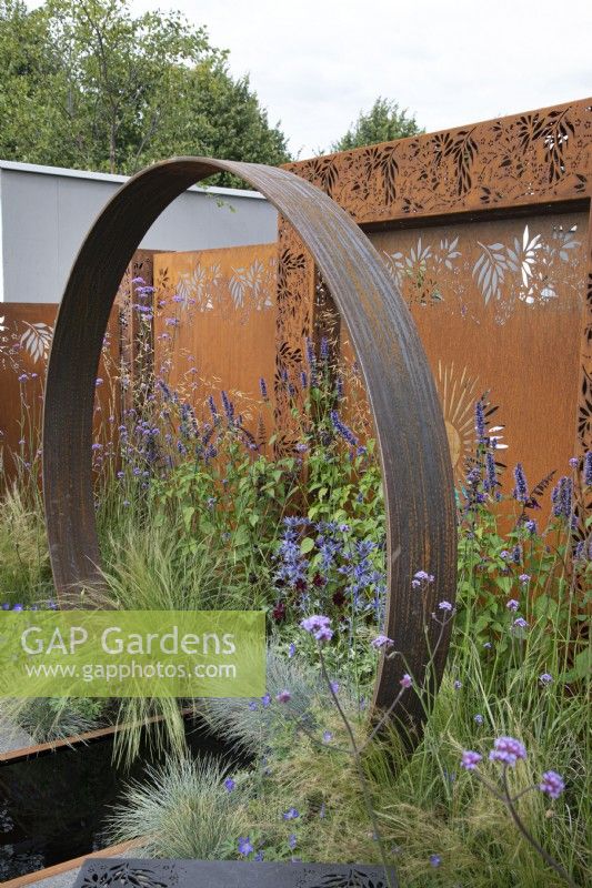 Corten steel moongate in the Sunburst garden at RHS Hampton Court Palace Garden Festival 2022