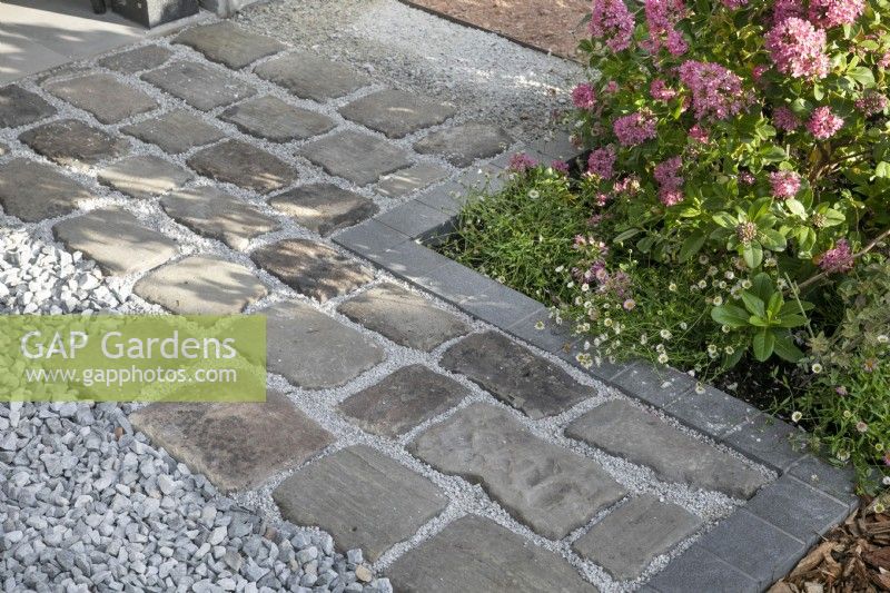 Hard landscaping examples - paving stones, gravel, edging stones, and bark