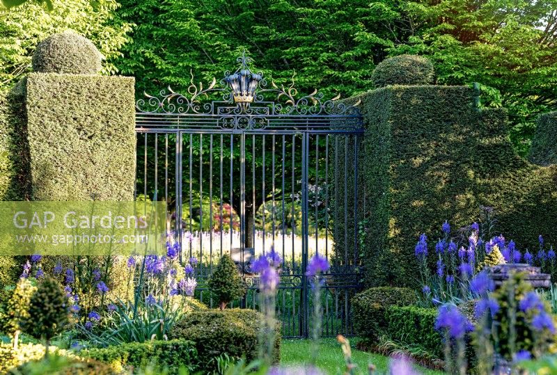 The reclaimed gates in the Sundial Garden, May, 2022.