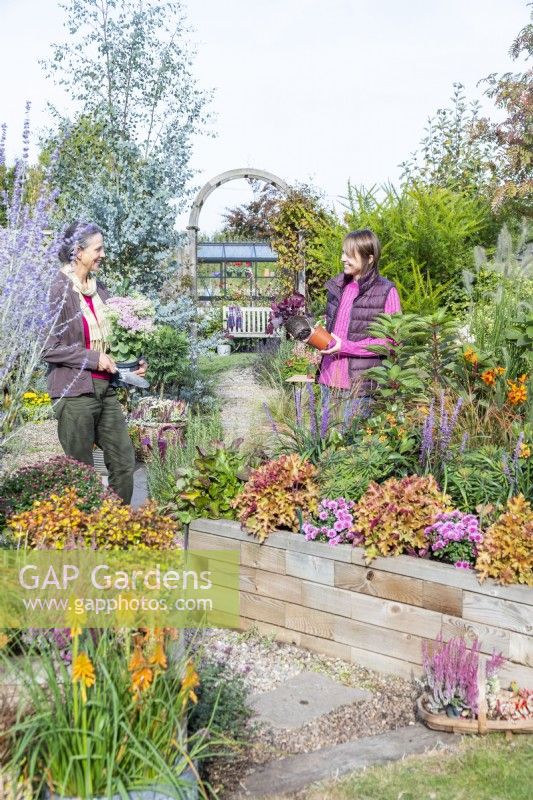 Women chatting while gardening
