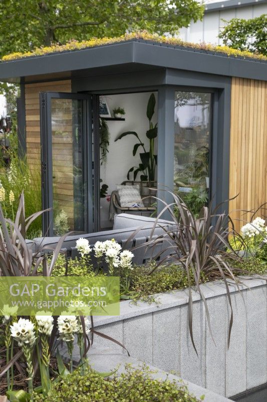 Wooden home office in the Nurture Through Nature Garden at BBC Gardener's World Live 2022