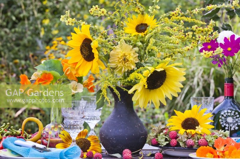 Yellow themed bouquet containing sunflower, goldenrod, dahlia and mullein.