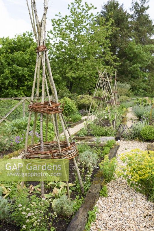 Kitchen garden with plant supports made from willow and hazel.