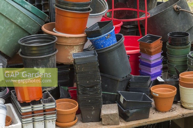 Gardener's potting table with assorted containers 