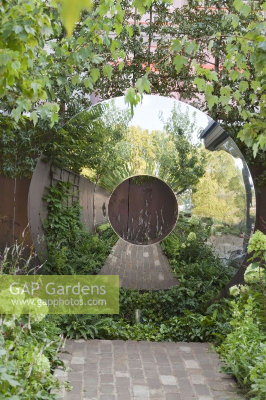 Circular round steel garden sculpture.