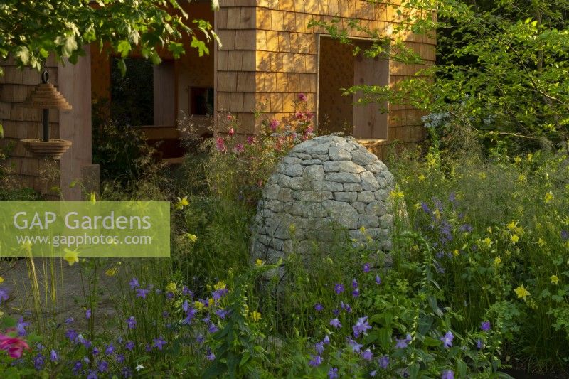 Horatio's Garden, a show garden featuring a woodland retreat, herbaceous planting and accessible areas for people affected by spinal injuries.  Designed by Charlotte Harris and Hugo Bugg.