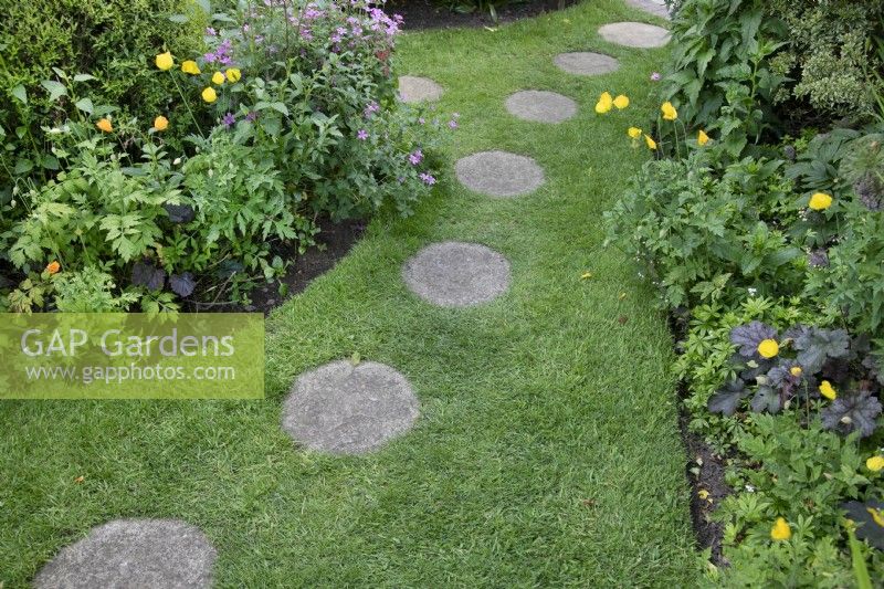 Stepping stones in the grass in Garden open for Charity, Four Oaks, June