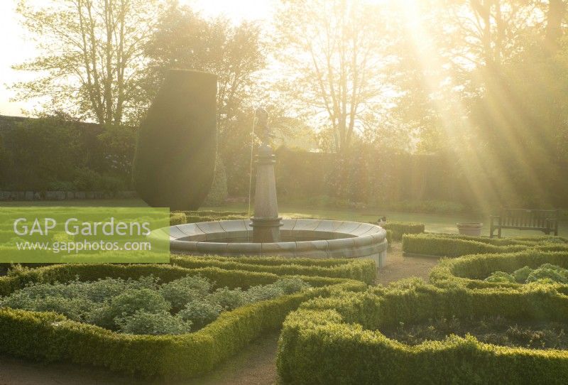 The Fountain Garden at sunrise  in the Crathes Castle Walled Garden.