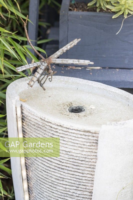 Small water fountain with dragonfly ornament