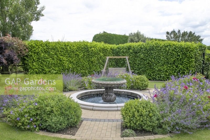 Front garden with circular pond and  fountain at New Fulfen Cottage, Lichfield, June