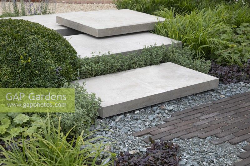 'Shades of Grey' at BBC Gardener's World Live 2021 - urban contemporary garden using different grey hard landscaping materials, August