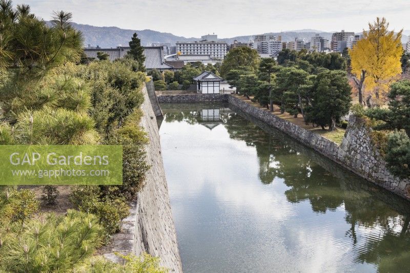 View from the Keep Tower of the Honmaru garden over the moat to the city beyond.