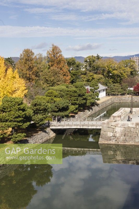 View from the Keep Tower of the Honmaru garden over the moat and bridge to the city beyond.