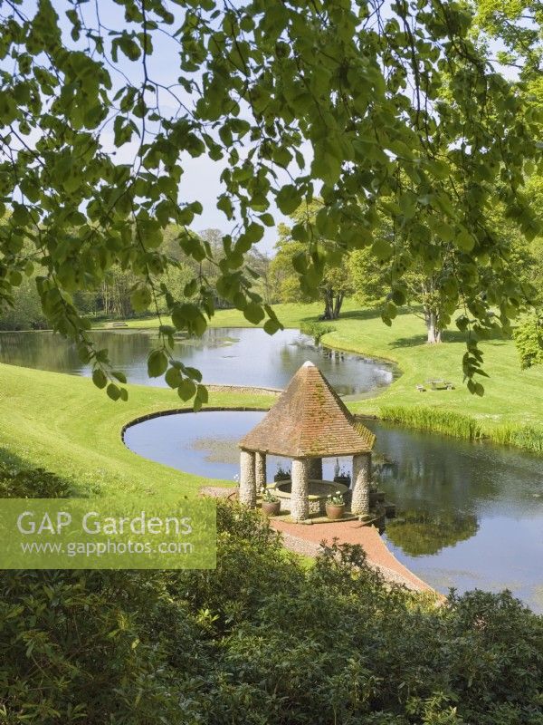 Gazebo and lakes in landscaped gardens at Kelling Hall Norfolk