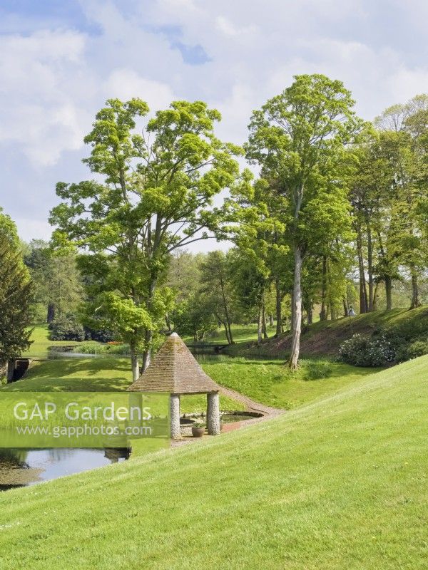 Gazebo and lakes in landscaped gardens at Kelling Hall Norfolk