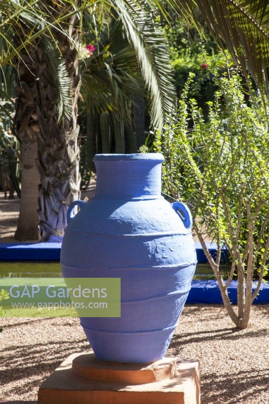 A blue painted amphora, terracotta container in Jardin Majorelle, Yves Saint Laurent garden