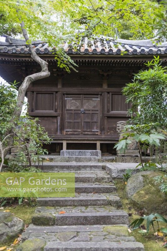 Steps to tea house with tiled roof.