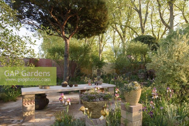 A table made of reclaimed materials in The Nurture Landscapes Garden, Designer: Sarah Price, Gold medal winner Chelsea Flower Show 2023
