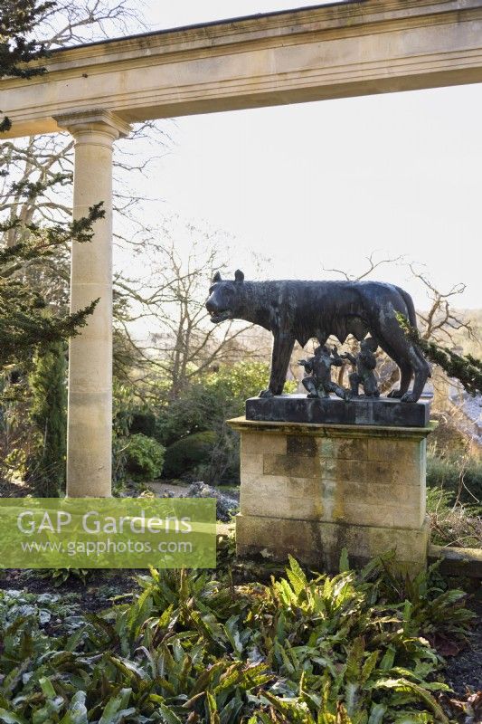 Statue of Romulus and Remus suckled by the she-wolf below the colonnade at Iford Manor in January