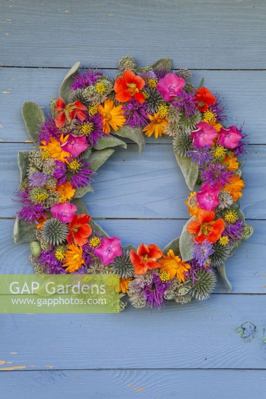 Summer wreath made of Echinops, Monarda, Astrantia, calendula and Stachys.