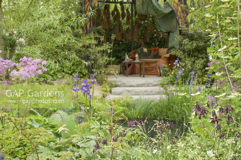 RHS Chelsea Flower Show 2023 -  pond and seting in The Boodles British Craft Garden designed by Thomas Hoblyn