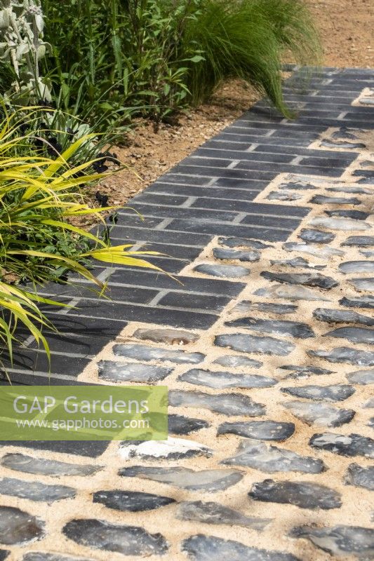 Grey brick and cobbled path  - designer Lucy Taylor - The Traditional Townhouse Garden -  RHS Hampton Court Palace Garden Festival.