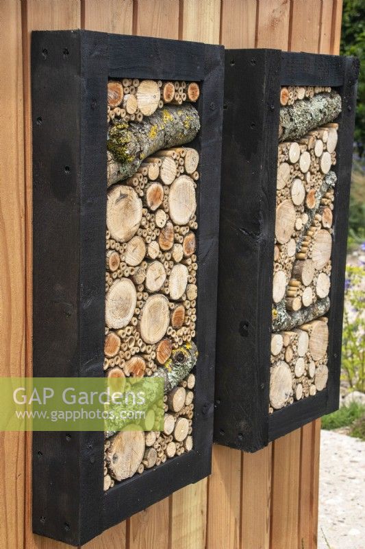 Decorative insect habitat panels - designer Tom Massey - RHS Resilient Garden, RHS Hampton Court Palace Garden Festival.