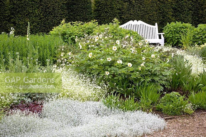 White garden with seating area 