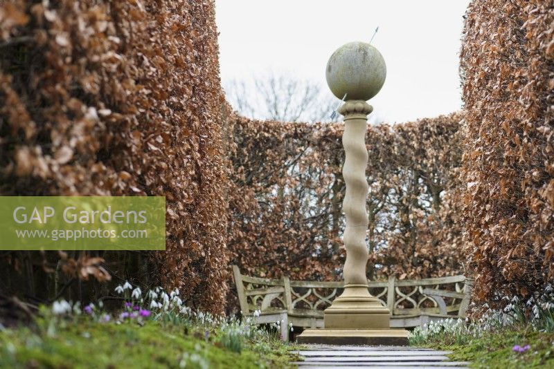 Barley sugar column with spherical sundial on the top at York Gate Garden in February