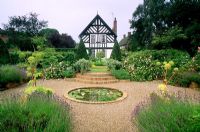 Circular pond in formal garden at Wollerton Old Hall in Shropshire