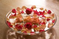 Water bowl with roses and petals