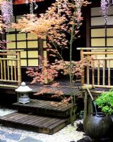 Japanese teahouse with water bowl, decking, Wisteria, Bamboo railing