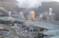 Hoar frost in the Sunk garden at Great Dixter in winter - sometimes also known as the Barn garden.