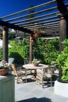 Seating under large pergola supported by wooden columns - San Francisco