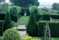 Overview of formal garden divided by Taxus hedges - Wollerton Old Hall, Shropshire.