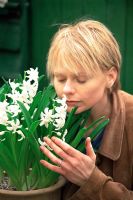 Woman smelling Hyacinthus - Hyacinth flowers in Spring