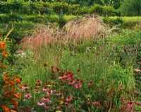 Border of late summer planting with perennials and grasses