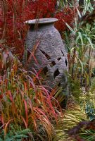 Urn resting in autumnal grasses, Designer Brian Cross, Lakemount, Ireland 